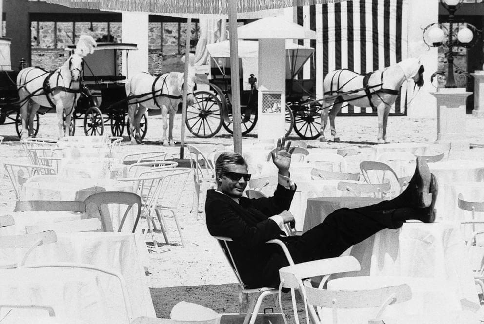 Image of Fellini waving his hand